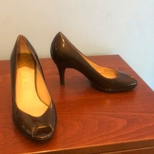 Cole Haan peep toe pumps.